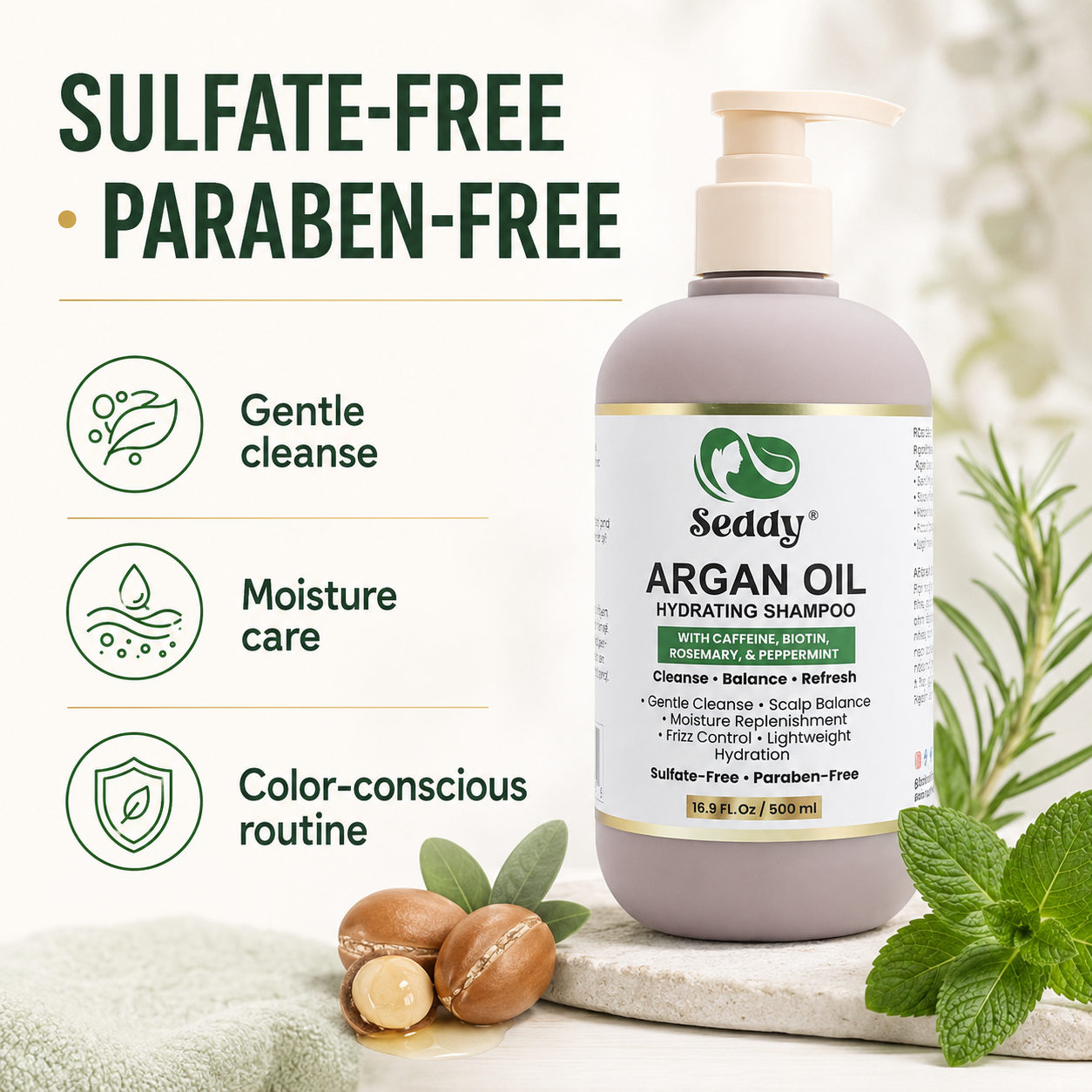 A bottle of Seddy Argan Oil Hydrating Shampoo stands on a light surface with mint leaves and argan nuts around it. The bottle is taupe with a cream pump and a white label with green and gold details.