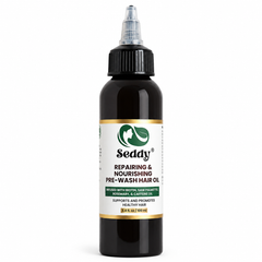 A bottle of Seddy Repairing & Nourishing Pre-Wash Hair Oil on a plain white background. The product is in a dark amber bottle with a black cap and a white label featuring green and gold accents.